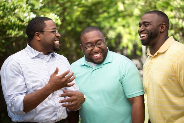 black men talking in the park